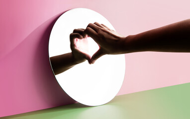 Fototapeta Conceptual Photo for Love and Relationship. Love Yourself. Single Person using Hand to Form a Heart Shape on the Mirror. Fill Yourself with Romance on Valentines Day obraz