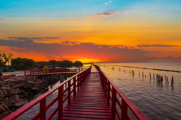 Sea coast and wooden bridge,View of wooden bridges and coastline at sunrise,Wooden bridge at the sea at sunset