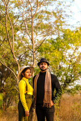 Pre wedding shot of an Indian couple in Nature's trail in Delhi, India. Romantic couple Shoot. Bride and groom in the natural forest of with trees. Mountain wedding Forest wedding Wedding photo shoot.