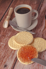 cookies with jam and coffee cup