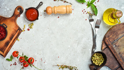 White kitchen background of cooking: vegetables, spices and kitchen utensils. Free space for text.