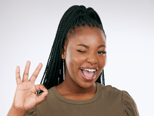 Portrait, ok sign and black woman with smile, confident and achievement with girl on studio...