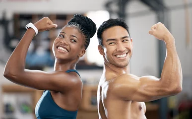 Fotobehang Sportschool Fitness, black woman or couple of friends flexing muscles for body goals in training, workout or exercise. Coaching results, teamwork or sports athletes with strong biceps, motivation or focus at gym  © J Maas/peopleimages.com