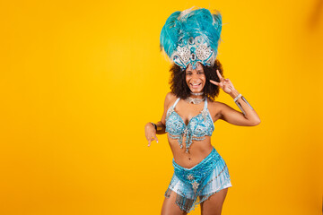 black woman queen of Brazilian samba school, with blue carnival clothes and crown of feathers....