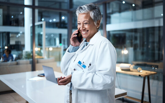 Doctor, Senior Woman And Phone Call In Hospital Conversation, Talking And Networking. Smartphone, Night And Female Medical Physician In Discussion, Telehealth Or Consulting For Support In Clinic.