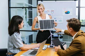 Business person meeting on solar cell panel technology. Business People Discussing Solar Power Environment Concept	