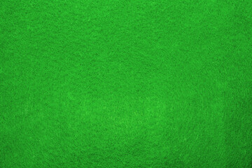 Naklejka na ściany i meble Texture of a sheet of green felt for needlework