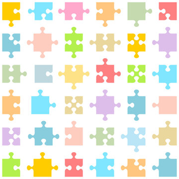 Jigsaw puzzle pieces of various shapes and colors fitting each other
