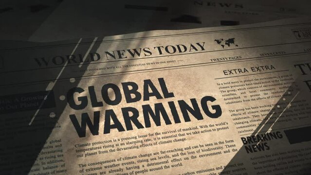 Global Warming headline in dramatic unveiling of newspaper article in old vintage daily newspaper in the archive of a newsroom