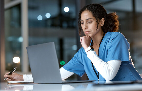 Doctor, thinking and writing with laptop at night for healthcare solution, idea or planning at hospital. Woman medical nurse working late in focus for research with notebook and computer at clinic
