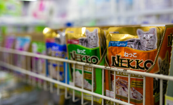 Nakhonsawan, Thailand - January 26, 2023: Picture of pet food in supermarket. Cat and dog food, Chicken food.