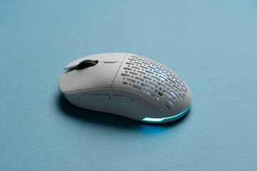 white new wireless computer mouse flat lay with led lights - obrazy, fototapety, plakaty