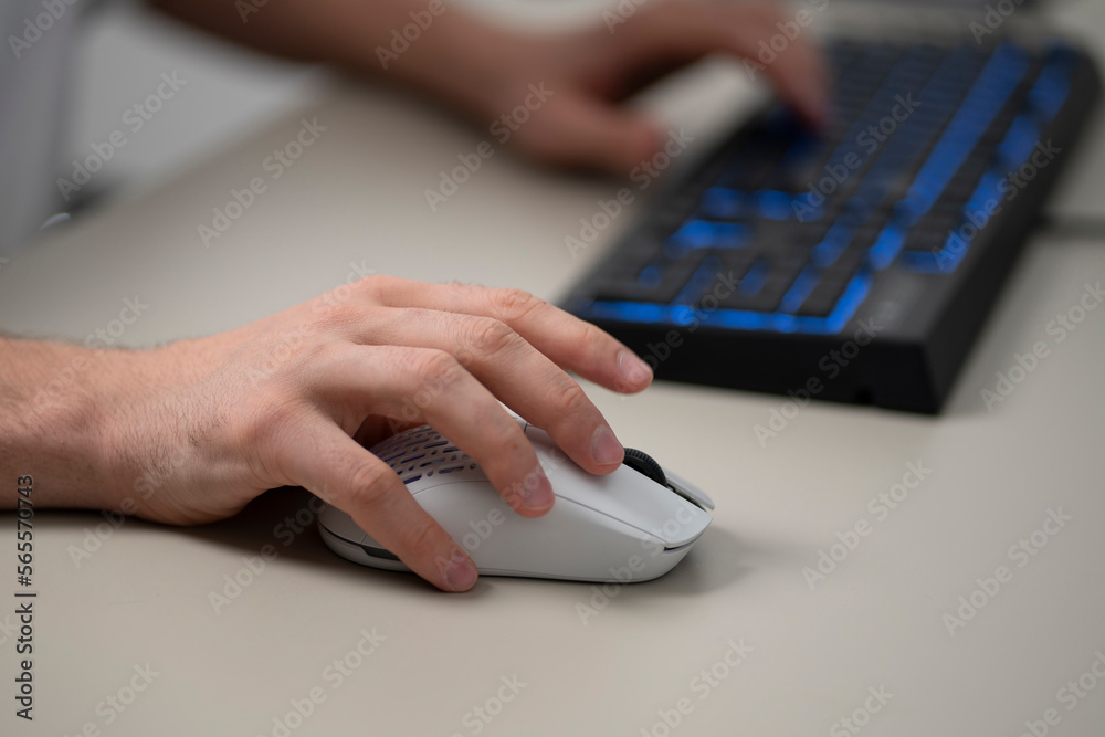 Wall mural office worker using a new white computer mouse