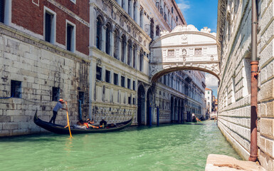 The Bridge of Sighs and gondola on canal in Venice, Italy.
