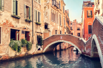Canal with bridge in Venice, Italy.