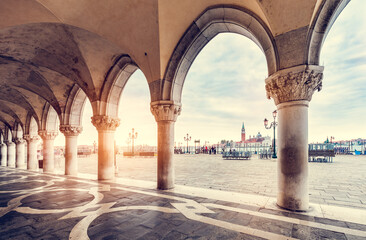 Ancient columns with arches at Palazzo Ducale or Doge's Palace in Venice, Italy