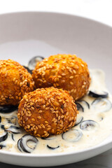 chickpeas balls with creamy black olives sauce