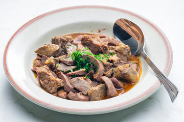 stew of meat, livers and kidneys