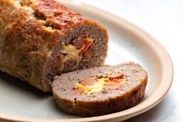 homemade meat loaf filled with egg and sausage