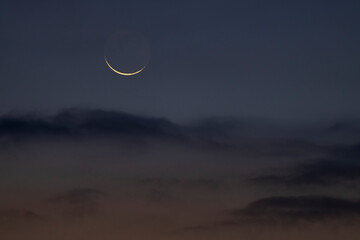 Naklejka na ściany i meble eclipse of the moon with clouds