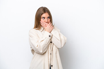 Young caucasian woman isolated on white bakcground covering mouth and looking to the side