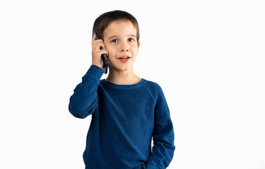 Studio shot of a child talking on his mobile phone isolated on white