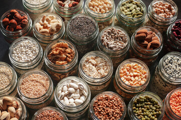 top view of seeds, nuts, peas, beans, rice, spelt, peas, oatmeal, lentils, pearl barley. Healthy vegetarian food.