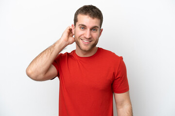 Obraz premium Young caucasian man isolated on white background laughing