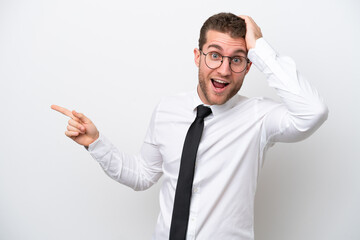 Young business caucasian man isolated on white background surprised and pointing finger to the side