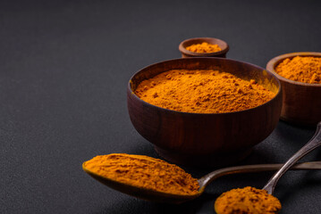 Bright yellow turmeric or curry spice for Asian food preparation