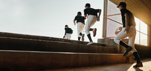 Baseball team, exercise and sport stadium training of professional athlete group doing a workout. Running, softball and cardio of sports game people doing a action run to pitch on field with mockup