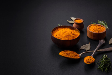 Bright yellow turmeric or curry spice for Asian food preparation