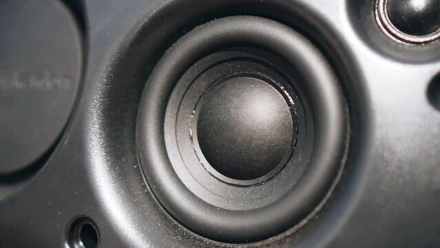 Close-up of the moving vibrating speaker of the acoustic column. Close-up shooting
