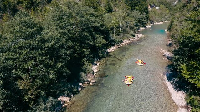 Tara river rafting.People are rafting the river on the boat.4k drone shot over the Tara river in Montenegro.Limpid fresh clean river water and rocks.Calm nature scenery of Montenegro and wild sport.