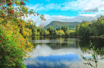 Fototapeta na wymiar Views of Glencoe Lochan with beautiful reflection in sunny days