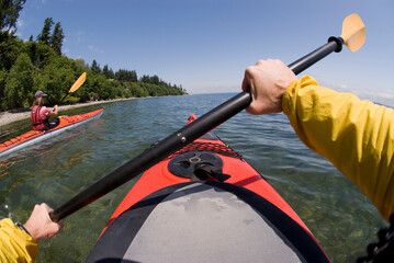 A couple kayaking in Puget Sound on June 9, 2007 near Bainbridge Island.
