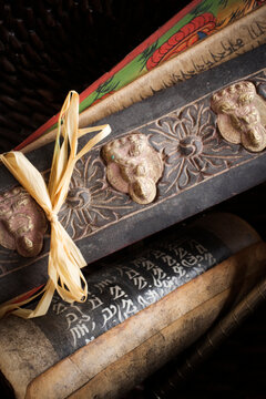 Close-up of Tibetan prayer holders and a prayer wheel.