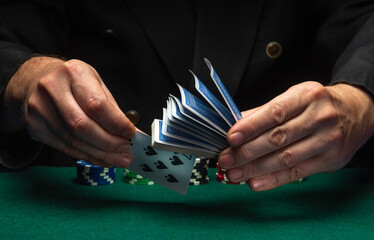 A sharpie draws seven spades from a deck of playing cards during a game of poker. The concept of...