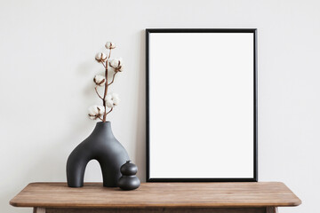 Empty vertical frame mockup in modern minimalist interior with plant in trendy vase on white wall background, Template for artwork, painting, photo or poster