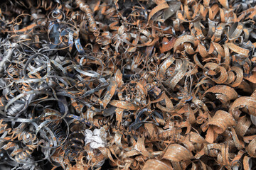 Rusty steel shavings close-up photo, industrial waste