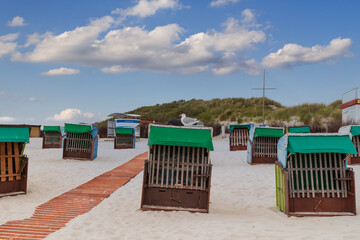 Beach chairs on the beach of island Heligoland. North sea. Germany.