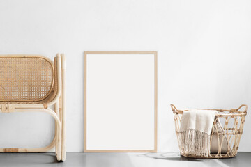 Blank frame mockup in modern interior design with trendy vase and chair on empty white wall...