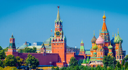 Spasskaya Tower of Moscow Kremlin and Cathedral of Vasily the Blessed (Saint Basil's Cathedral) on Red Square in summer day. Panoramic view. Moscow. Russia