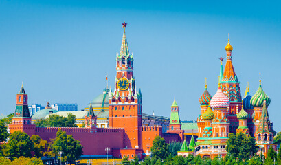 Spasskaya Tower of Moscow Kremlin and Cathedral of Vasily the Blessed (Saint Basil's Cathedral) on Red Square in summer day. Panorama. Moscow. Russia