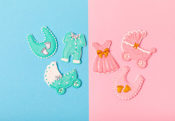 Boy or girl.A set of delicious baby shower cookies on a colorful background. Gender cookies.Baby shower party. Close-up. Flat lay. Place for text.