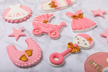 Obraz na płótnie Canvas Set of delicious baby shower cookies on a white marble background. Gender cookies.Baby shower party. Close-up. Flat lay. Place for text.