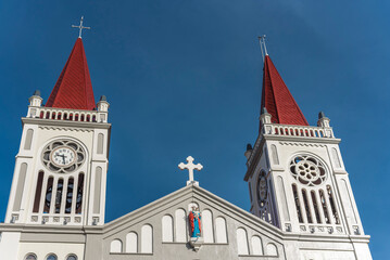 Fototapeta na wymiar Baguio City, Philippines - The twin spires of Our Lady of the Atonement Cathedral or Baguio Cathedral. Part of the Archdiocese of Nueva Segovia