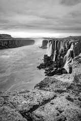 Dettifoss waterfall, Iceland. Black and white abstract long exposure dreamy picture of one of the biggest waterfalls in Europe. Famous Icelandic landmark and travel destination.