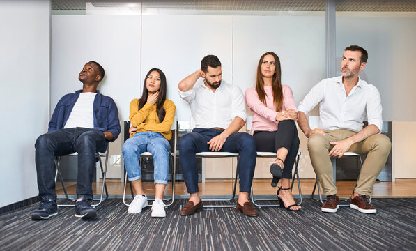 Group of stressed diverse people waiting for job interview