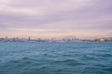 Istanbul, Turkey, 01.20.2023: Bosphorus and Istanbul skyline at sunset. Sunset landscapes. Turkey's touristic places and sights. Sea and city views. Istanbul background pictures.